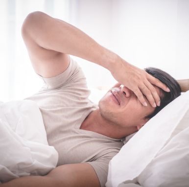 man-bed-woke-up-with-headache