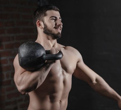 man-exercising-with-kettlebell-gym